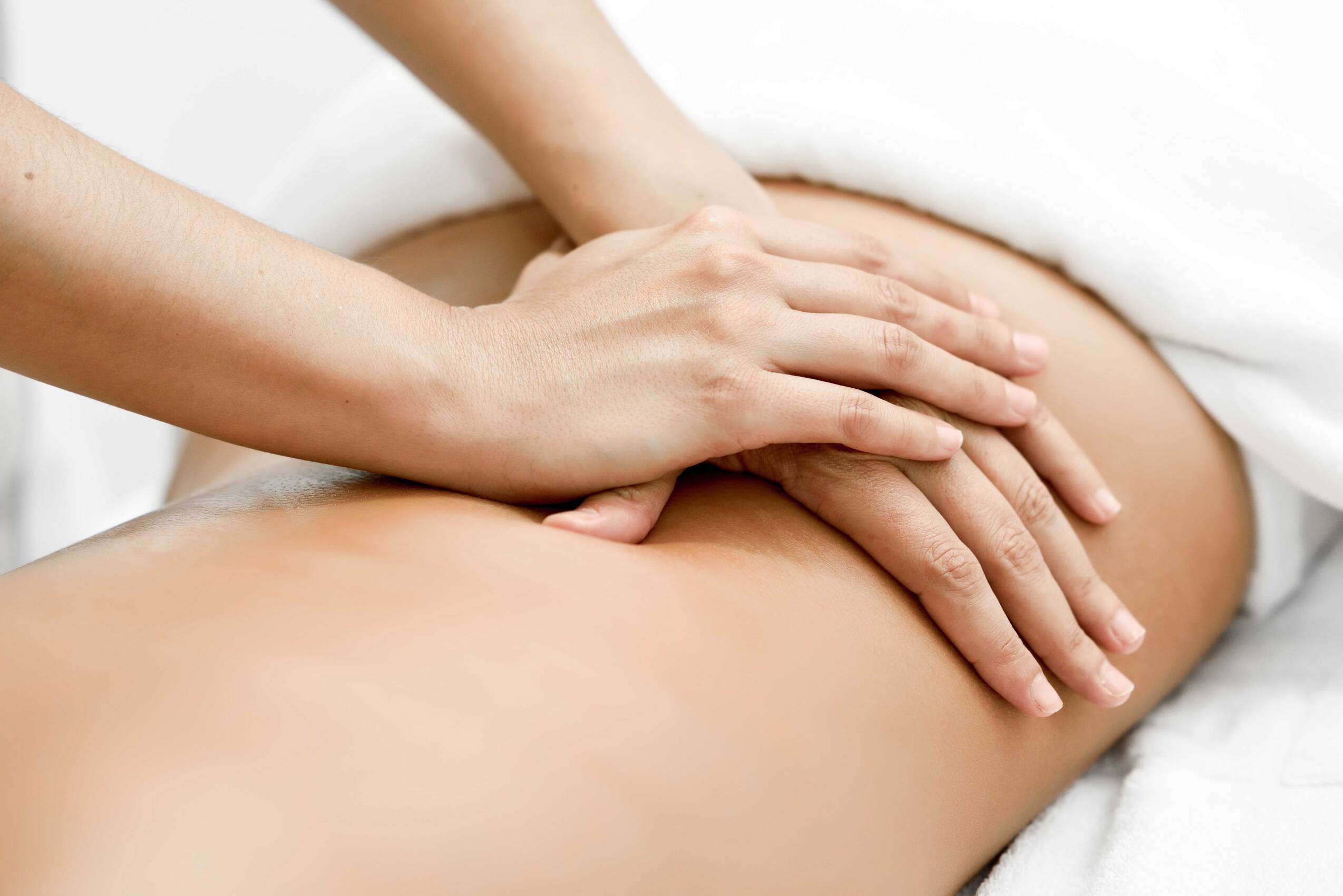Young woman receiving back massage spa center (1)