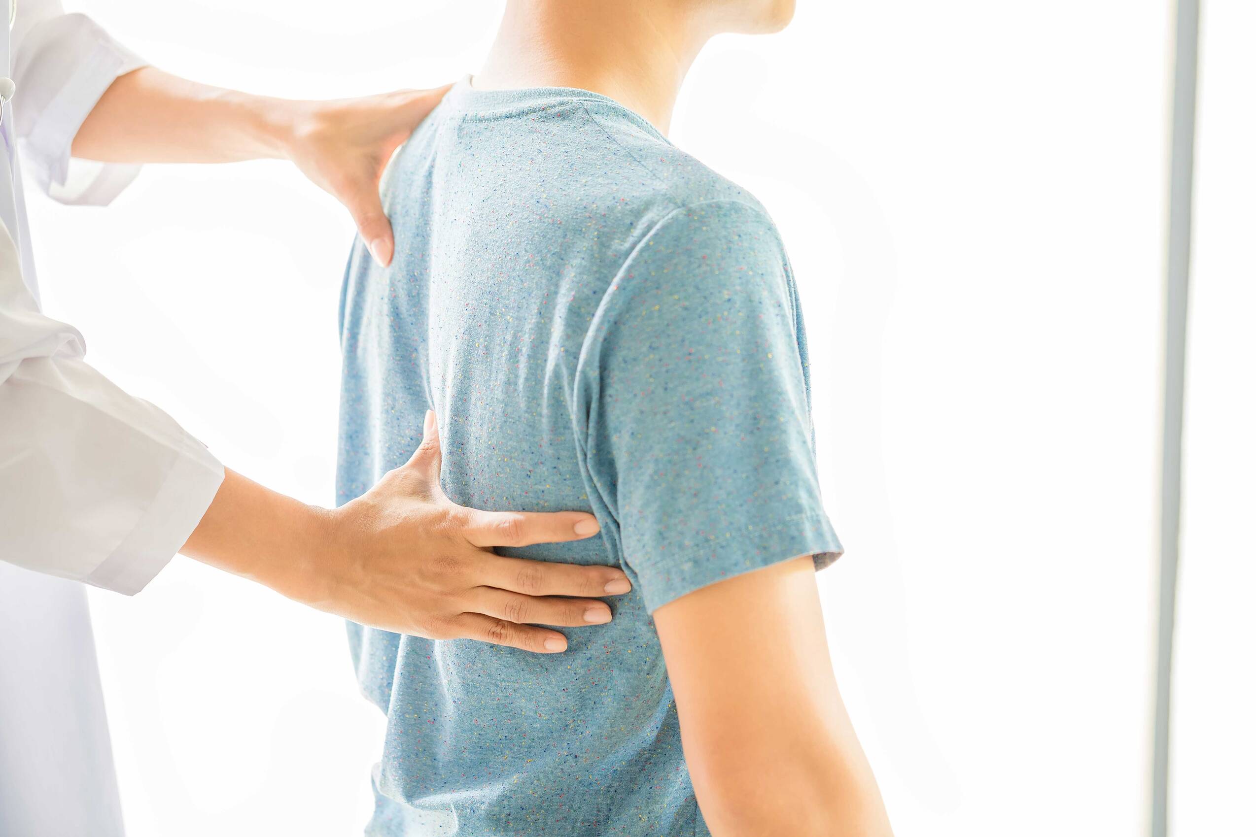Close up physiotherapist working with patient clinic